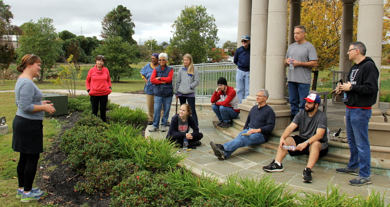 Tammy Buchanan-Anderson (left), the chair of the Liberty Garden Park Committee and co-coordinator for the work project on October 29, 2019, sums things up at the end of the morning's work. Others in the photo are (left  to right) Marion Cone, Shirley Collier, Edna Jepsen, Addison Osborne (standing), Megan Ledbetter (seated), Matthew Latham (seated), Dr. Terry Lindley (standing), Dr. David Thomas (seated), Dr. Henry Allen (standing), Nicholas Terra (seated), and Dr. Keith Bates (standing).