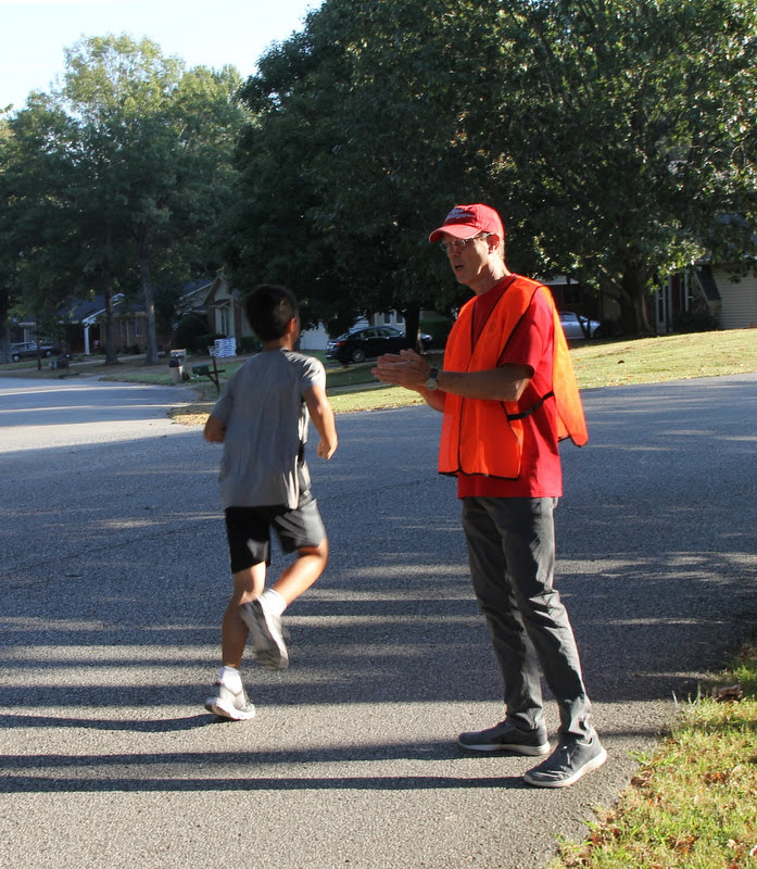 Robert Briley encourages runners at the Racing So They Can Ride races on September 21, 2019.