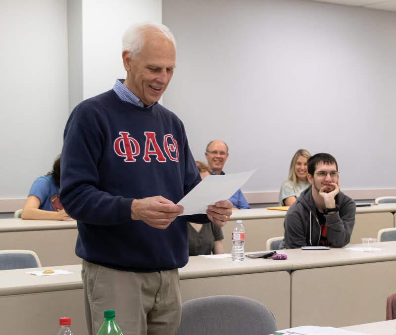 Dr. Stephen Carls reads a letter of congratulations from the national office of Phi Alpha Theta to the newly initiated members of the Delta-Psi chapter on September 24, 2019. Photo by Joey Echeverria