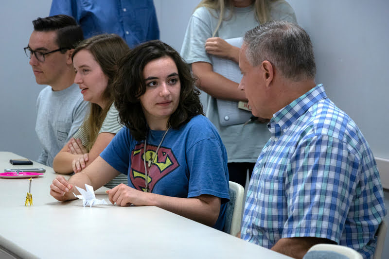 Attendees at the fall-semester plenary meeting of Phi Alpha Theta on September 24, 2019, wait for the gathering to begin.  They are (left to right) Mac Hazlerig, Rebekah Lisle, Leah Atkins, and Dr. Henry Allen. Photo by Joey Echeverria
