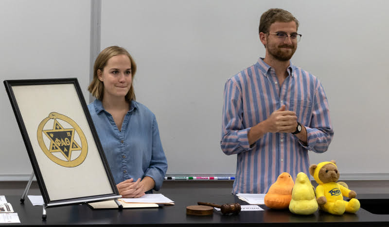 Phi Alpha Theta President Luke Sower opens the Delta-Psi chapter's fall plenary meeting on September 24, 2019. Chapter Vice President Megan Ledbetter is at his side. Photo by Joey Echeverria