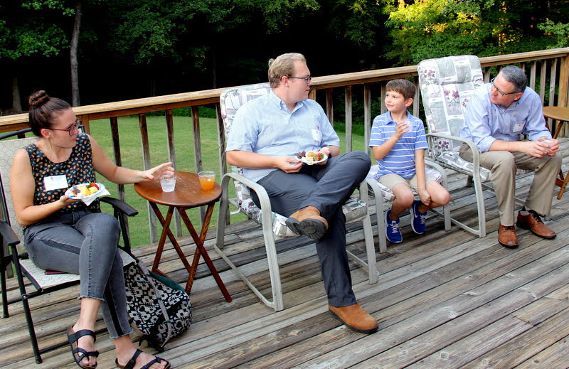 Attendees enjoy the food and conversation at the History Welcome Reception on September 9, 2019. They are (left to right) Katie Allison, Nathan Heatherly, Colin Bates, and Dr. Keith Bates.
