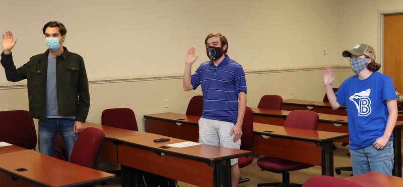 Jack Waters (left to right), Walker Beasley, and Elizabeth Blevins recite the Phi Alpha Theta membership oath at the Delta-Psi chapter's fall plenary meeting on September 30, 2020.