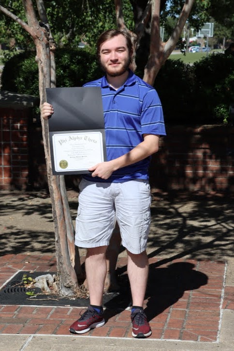 Walker Beasley displays his Phi Alpha Theta membership certificate at the end of the Delta-Psi chapter's fall plenary meeting on September 30, 2020.