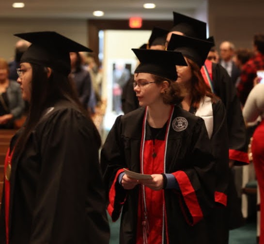 Graduating history major Elizabeth Blevins (center) participates in the processional at Union University's fall commencement on December 11, 2021. Photo by Kristi Woody
