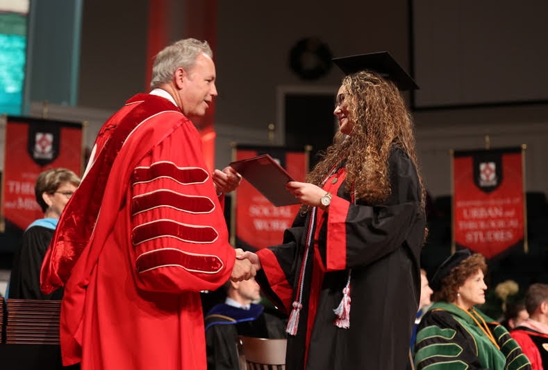 Graduating history major Johnna Wade accepts her B.A. diploma from President Samuel W. Dub Oliver at Union's fall undergraduate commencement ceremony on December 11, 2021. Photo by Kristi Woody