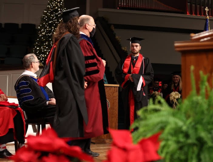 Graduating history major Jack Waters prepares to be hooded at Union's fall commencement on December 11, 2021, for completing the Discipline-Specific Honors Program in History. Photo by Kristi Woody