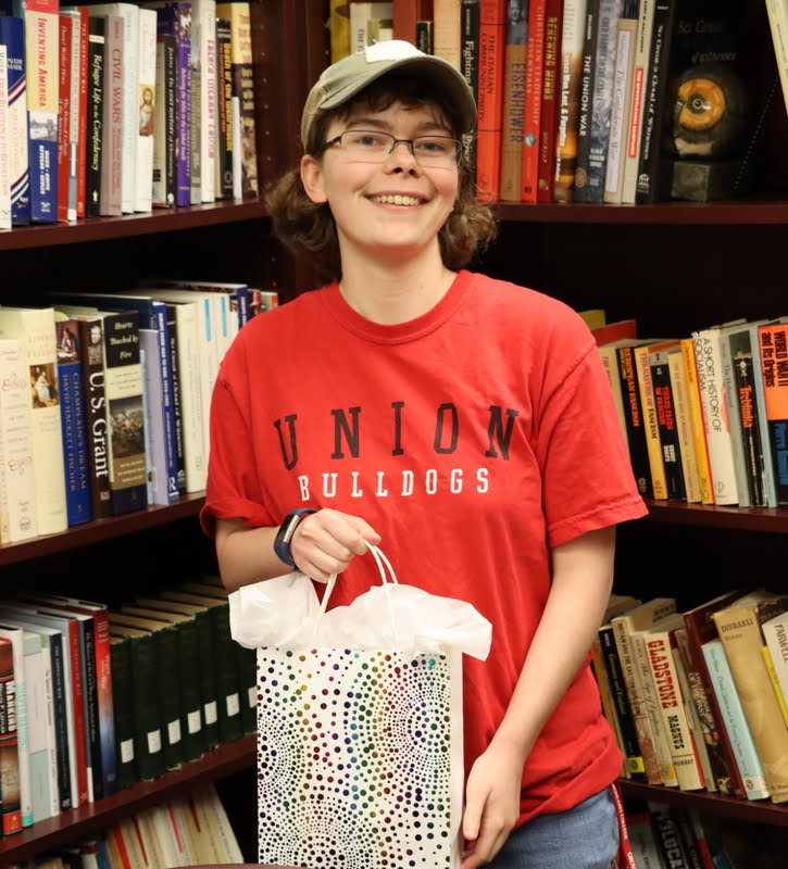 Graduating history major and Phi Alpha Theta member Elizabeth Blevins receives her history department awards packet on December 3, 2021.