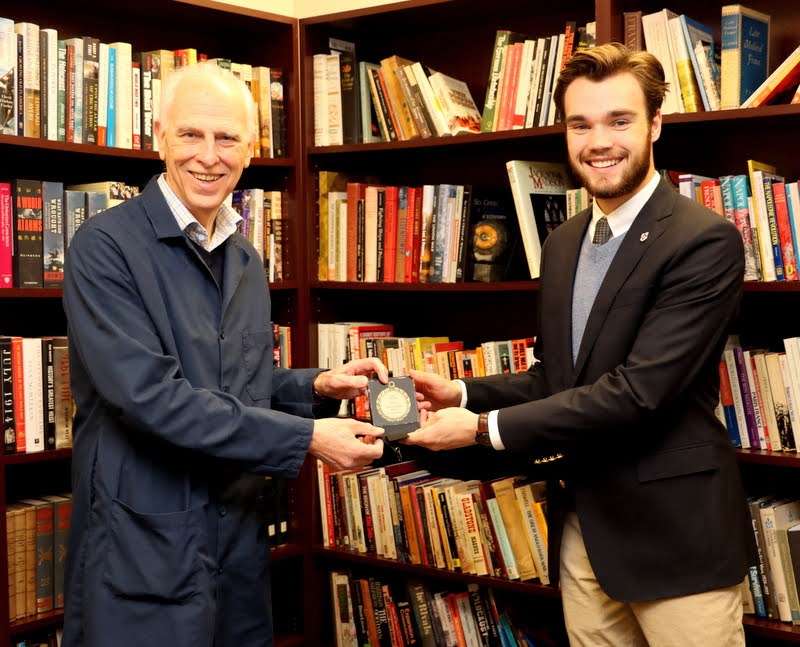 Dr. Stephen Carls (left) presents Union University's Academic Excellence Medal in History to Jack Waters on December 8, 2021.