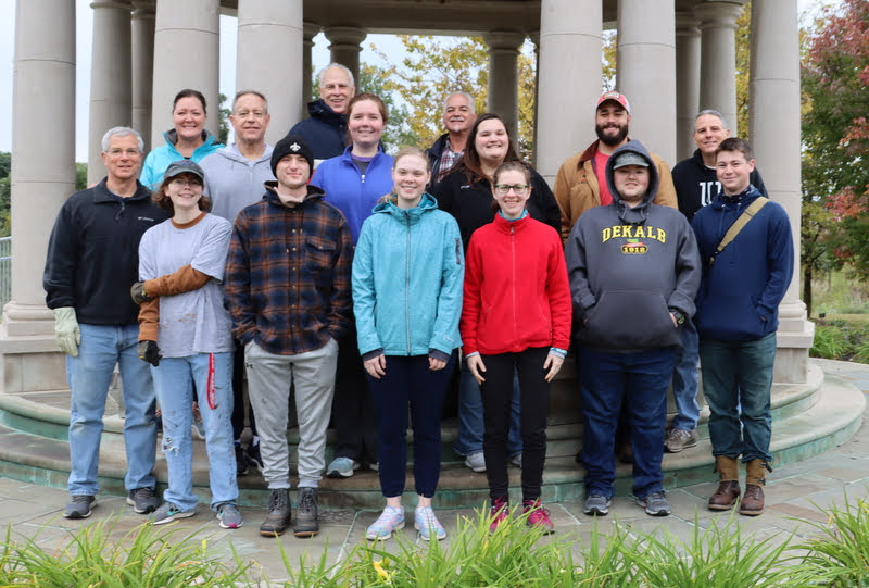 Union University's history department work volunteers join with project coordinators for a photo at the beginning of their community service project at Liberty Garden Park on November 2, 2021. They are: (front row, left to right) Dr. David Thomas, Elizabeth Blevins, Joe Gee, Anna Guelcher, Anne Adams, Logan Sherrod, and Noah Kea; (second row, left to right) Dr. Henry Allen, Abigail Gilbert, Sandra Allen, Nicholas Terra, and Dr. Keith Bates; (back row, left to right) project coordinators Tammy Buchanan-Anderson, Dr. Stephen Carls, and Jack Baudo.
