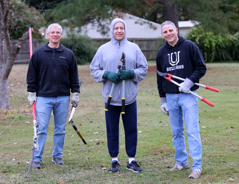 Drs. David Thomas (left to right), Henry Allen, and Keith Bates display their trimming tools during the history department's community service project at Liberty Garden Park on November 2, 2021. Photo by Kristi Woody