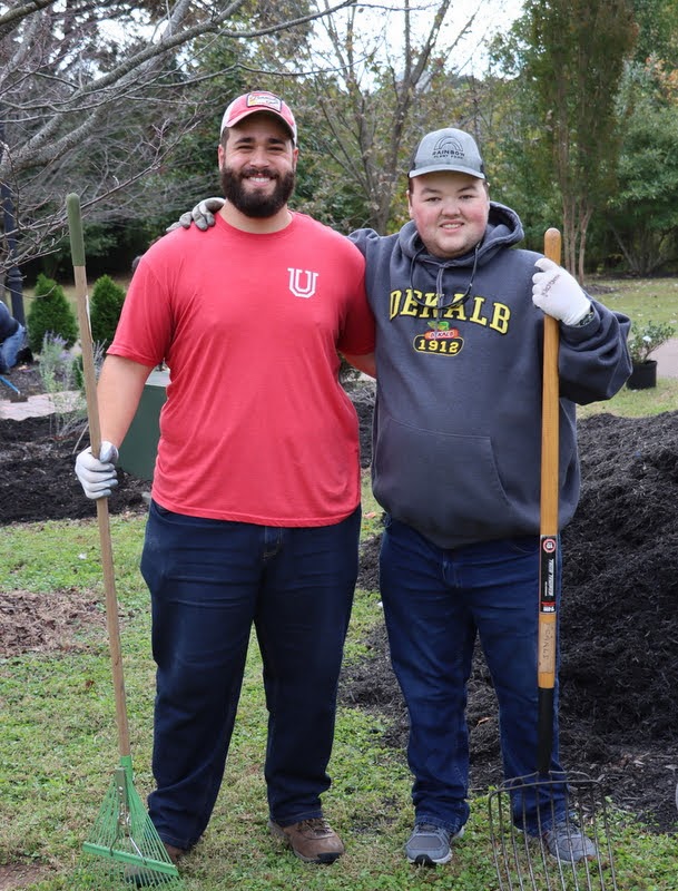 Union students Nick Terra (left) and Logan Sherrod take a break from mulching at Liberty Garden Park on November 2, 2021.