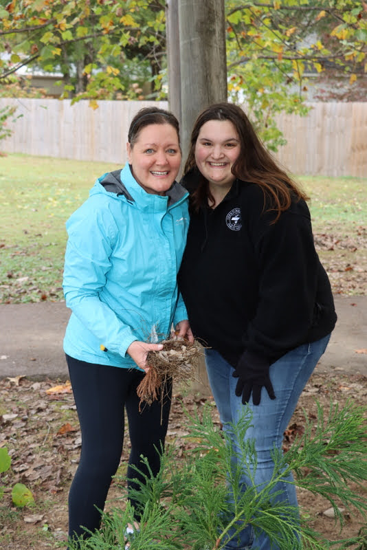 Tammy Buchanan-Anderson (left) and Sandra Allen take a break from their work at Liberty Garden Park during the Union University history department's community service project there on November 2, 2021.