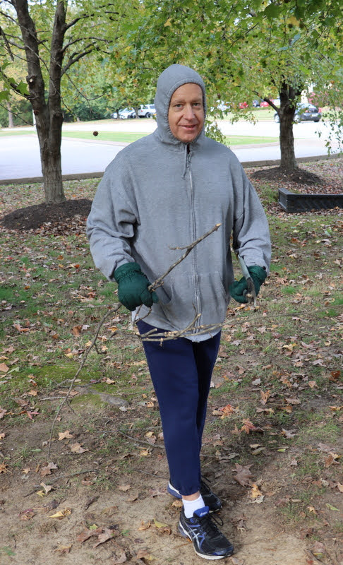 Dr. Henry Allen gathers twigs at the community service project that Phi Alpha Theta and the Rutledge Honorary History Club co-sponsored at Liberty Garden Park on November 2, 2021.