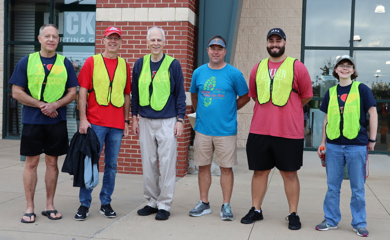 Phi Alpha Theta volunteers at the Racing So They Can Ride 5k and 10k races on September 18, 2021, join race coordinator Ron Kwasigroh (third from right) for a photo prior to the start of the event. The Union volunteers are (left to right) Dr. Henry Allen, Robert Briley, Dr. Stephen Carls, Nicholas Terra, and Elizabeth Blevins.