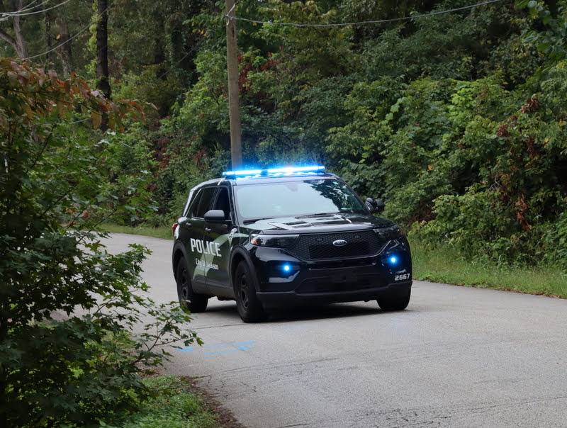 A City of Jackson police vehicle provides safety protection for the runners in the Racing So They Can Ride races on September 18, 2021.