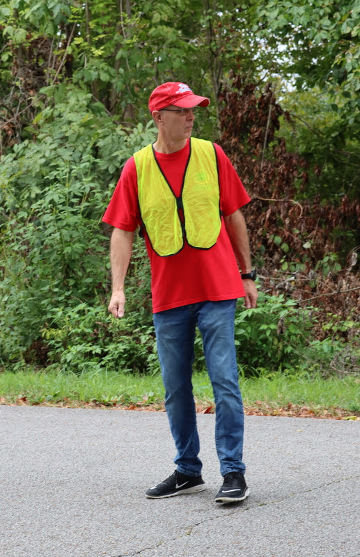 Phi Alpha Theta member Robert Briley helps guide and protect runners and walkers at the Racing So They Can Ride 5k and 10k races in Jackson on September 18, 2021.