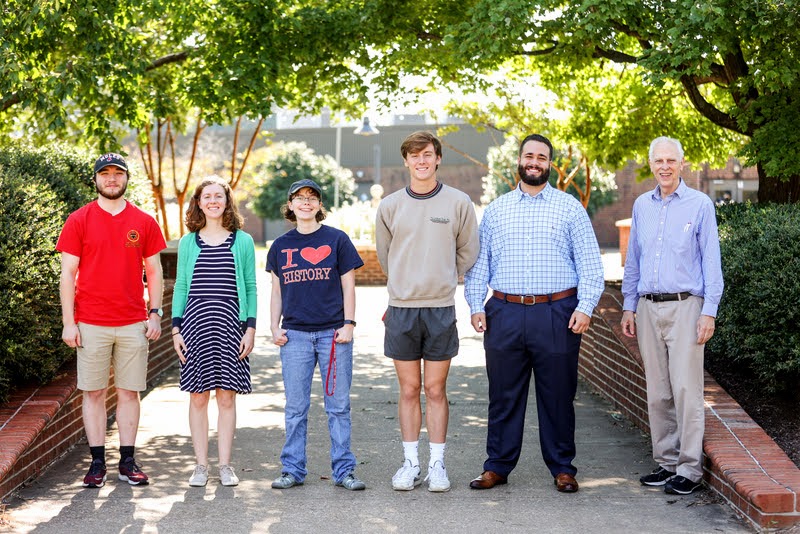 The Delta-Psi chapter officers of Phi Alpha Theta stand together near Union's fountain at the end of the chapter's plenary meeting on September 27, 2021. They are (left to right): Walker Beasley, senator; Anne Adams, senator; Elizabeth Blevins, secretary; Tad Binkley, vice president; Nick Terra, president; and Dr. Stephen Carls, faculty advisor. Photo by Kristi Woody