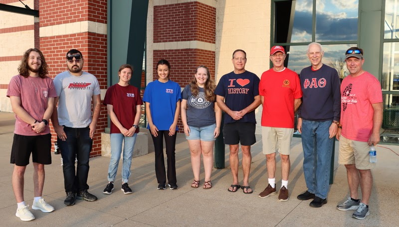 Phi Alpha Theta volunteers stand with Racing So They Can Ride coordinator Ron Kwasigroh (right) on the morning of September 17, 2002. They are (left to right) Nicholas Palmer, Christian Young, Anna Yadkowski, Makayla Baker, Breanna Edmiston, Dr. Henry Allen, Robert Briley, and Dr. Stephen Carls.