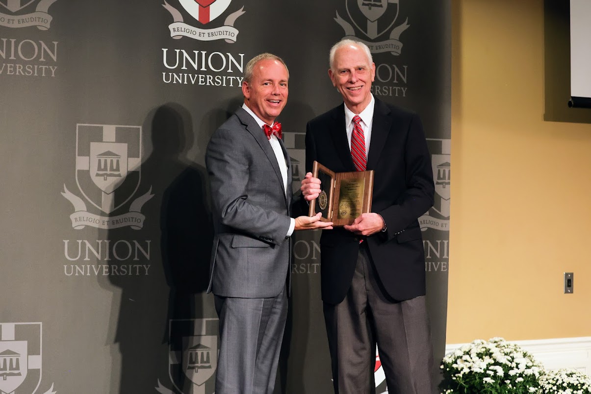 Dr. Stephen Carls (right) receives his Hall of Honor Award Plaque from Union University President Dr. Dub Oliver at the Bicentennial Legacy Luncheon in the Carl Grant Events Center on September 23, 2022. Photo by Suzanne Rhodes