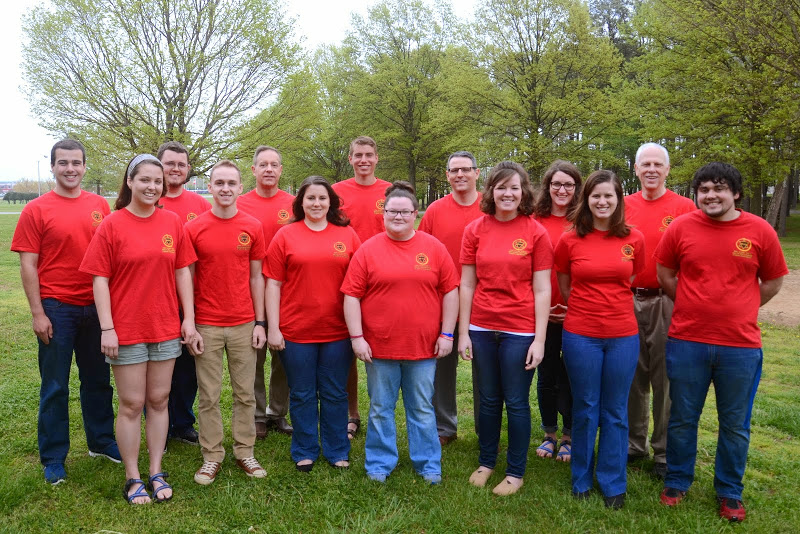 Participants in Phi Alpha Theta's Red T-shirt Spirit Day join together for a photo on the grounds outside Union's chapel on April 13, 2015.