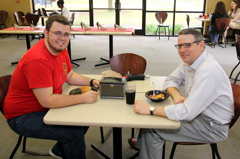 Delta-Psi Chapter President-elect Nick Hancock (left) and Dr. Keith Bates share lunch together on Phi Alpha Theta's Red T-shirt Spirit Day on April 13, 2015.