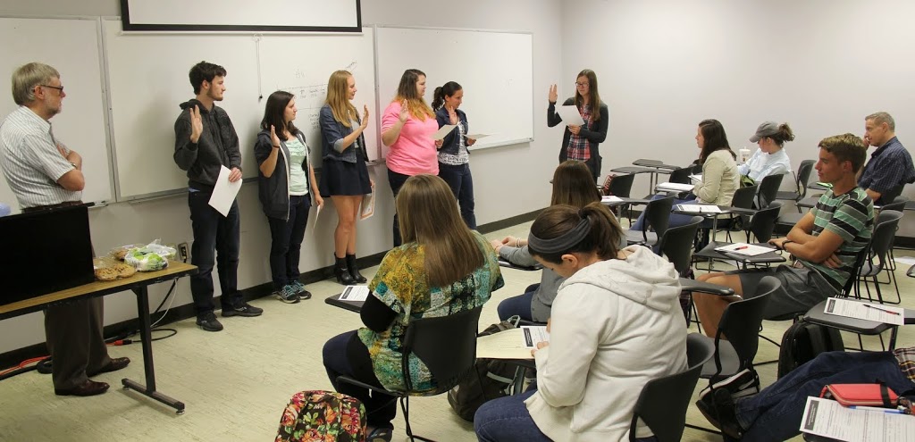 Rutledge Honorary History Club President Bree McCuin conducts the initiation ceremony for new members at the club meeting on April 14, 2015. The initiates are: (left to right) Peter McDaniel, Lydia Black, Alexandria Renckens, Jessica Barton, and Joanna Butcher. Dr. Terry Lindley, the club's faculty advisor, is standing at the left.