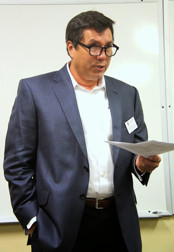 Dr. Andrew Tiger, the session chair for business and history papers at the Union University Scholarship Symposium on April 28, 2015, introduces history paper presenter Faith Bagley.