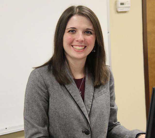 Caitlin Roach, a 2012 Union University graduate with a dual major in history and English, prepares to deliver her paper at the Union University Scholarship Symposium on April 28, 2015.