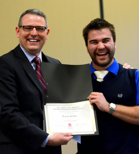 Dr. Keith Bates (left) presents the second place prize in the Dr. James Alex Baggett History Research Paper Competition to Kenan Keller during the history awards banquet on April 30, 2015.  Photo by Emily Stookey