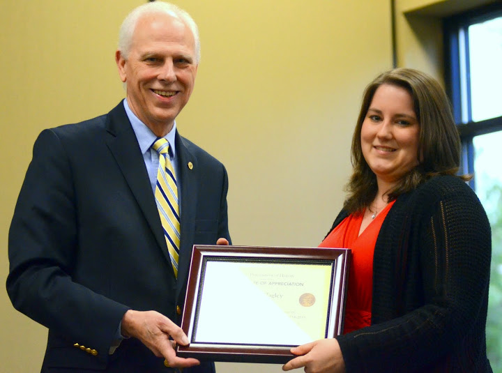 Faith Bagley accepts a certificate of appreciation from Dr. Stephen Carls at the history awards banquet on April 30, 2015, for her work as president of the Delta-Psi chapter of Phi Alpha Theta in 2014-2015.  Photo by Emily Stookey
