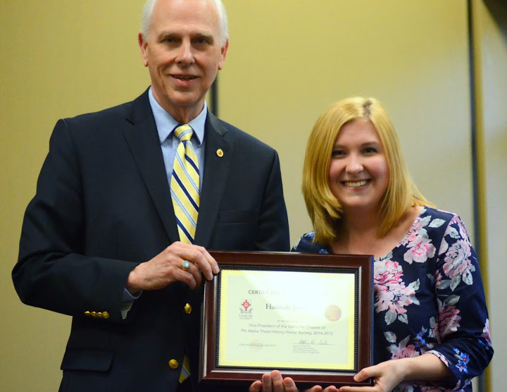 Dr. Stephen Carls presents a certificate of appreciation to Hannah Jones at the history awards banquet on April 30, 2015, for her work as the 2014-2015 vice president of the Delta-Psi chapter of Phi Alpha Theta.  Photo by Emily Stookey