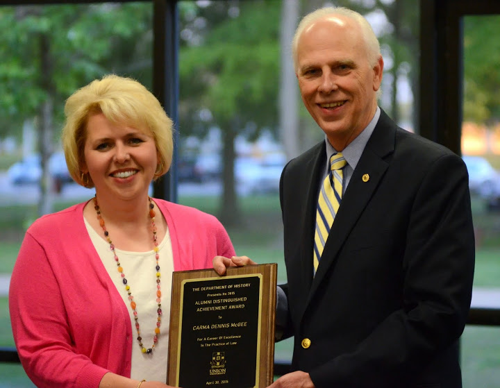 Chancellor Carma Dennis McGee accepts the Seventh Annual History Alumni Distinguished Achievement Award from Dr. Stephen Carls at the history awards banquet on April 30, 2015. Photo by Emily Stookey