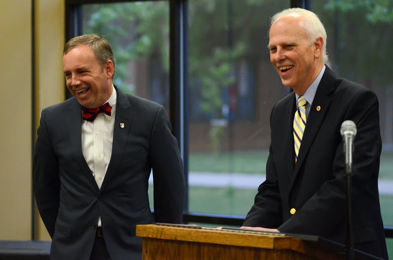 Union University President Dr. Samuel W. 'Dub' Oliver (left) and Dr. Stephen Carls enjoy a light moment during the presentation of a Phi Alpha Theta membership certificate to Dr. Oliver on April 30, 2015. Photo by Emily Stookey