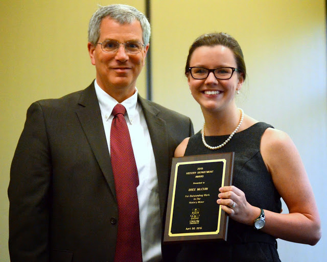 Bree McCuin joins with Dr. David Thomas for a photo during the presentation of the History Minor Award at the annual history awards banquet on April 30, 2015.