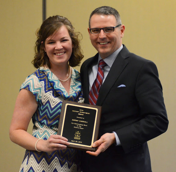 Sarah Carroll accepts the History Major Award from Dr. Keith Bates at the History Department Awards Banquet on April 30, 2015.  Photo by Emily Stookey