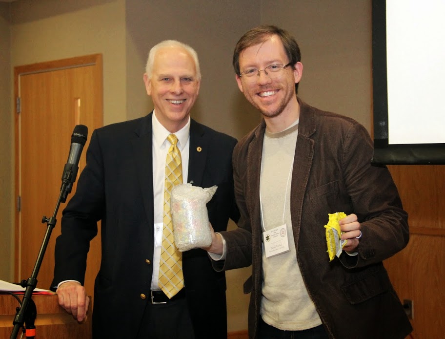 National Phi Alpha Theta President Dr. Stephen Carls (left) presents Tennessee Phi Alpha Theta conference co-chair Dr. Jason Verber with a Peeps Pop Art Mug and some chocolate-covered Peeps during the conference luncheon  program at Austin Peay State University on February 28, 2015.