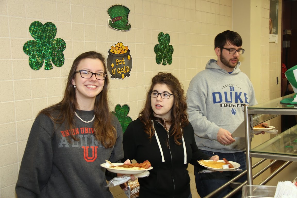 Members of the Union University group at the Jackson Old Hickory Rotary Club Pancake Breakfast go through the food line on March 14, 2015.