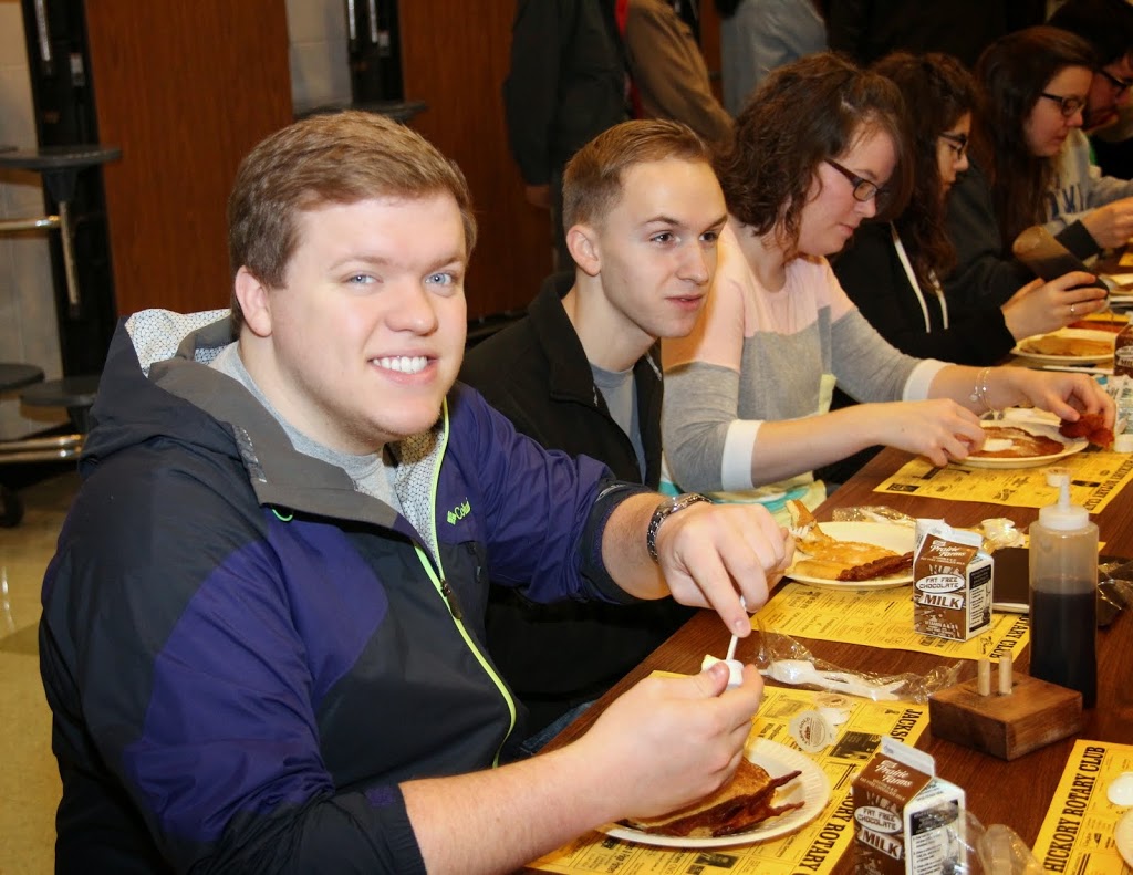 Members of the Union University group at the Jackson Old Hickory Rotary Club Pancake Breakfast on March 14, 2015, enjoy good food and fellowship together.