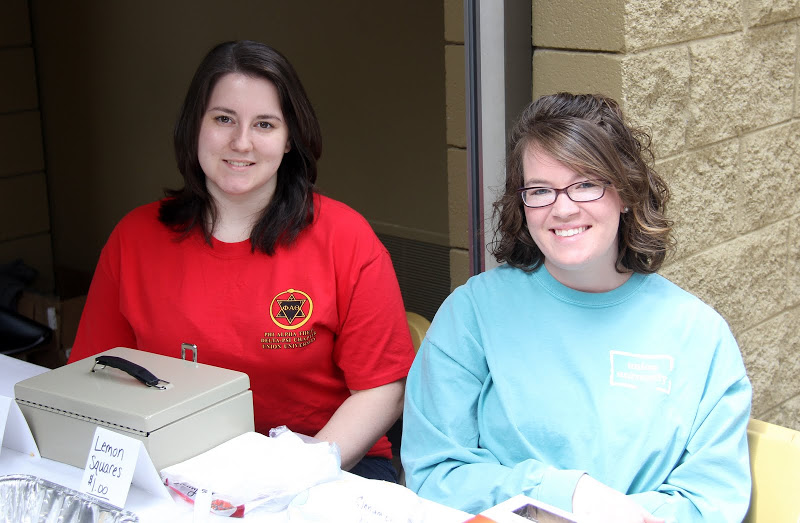 Faith Bagley (left) and Sarah Carroll handle the sales table outside the Lex at the Phi Alpha Theta bake sale on March 18, 2015.