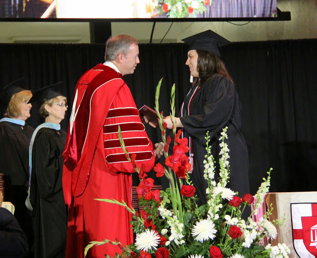 History major and Phi Alpha Theta member Faith Bagley receives her BA diploma from Union University President Dr. Samuel W. Oliver at Union University's commencement services on May 16, 2015.