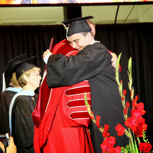History major Kenan Keller embraces Union University President Dr. Samuel W. Oliver after receiving his BA diploma at Union University's graduation at the Oman Arena on May 16, 2015.
