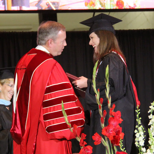 History minor and Phi Alpha Theta member Kayla Ketner accepts congratulations from Union University President Dr. Samual W. Oliver after receiving two diplomas at Union's commencement exercises on May 16, 2015.