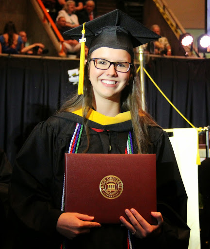 Phi Alpha Theta member Bree McCuin pauses for a photo after receiving her BS diploma at Union University's graduation on May 16, 2015.