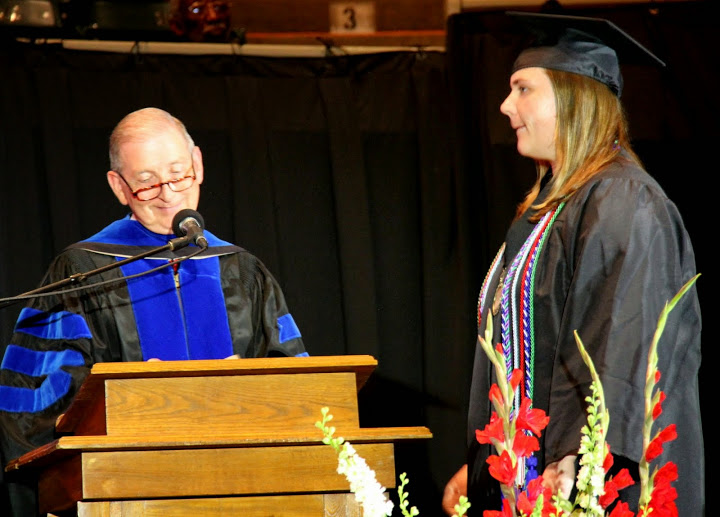Graduating minor Zensie Zills waits for Dr. Tom Rosebrough, Executive Dean of the College of Education and Human Studies, to announce her name at Union University's spring commencement exercises on May 16, 2015. She earned a BS degree with a major in Teaching and Learning.