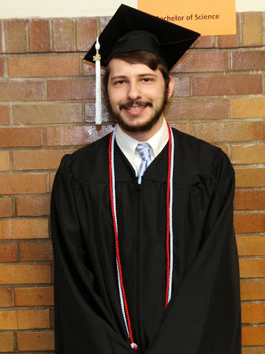 Phi Alpha Theta member Hunter Hawes stands in the lineup area assigned to BA students in theology prior to Union's spring graduation on May 16, 2015.