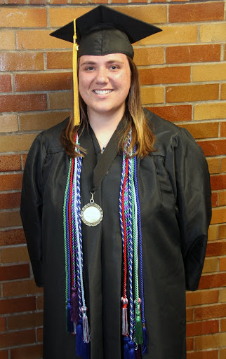 Phi Alpha Theta member Kensie Zills waits in the area assigned to students in the College of Education and Human Studies prior to Union University's spring graduation at the Oman Arena on May 16, 2015.