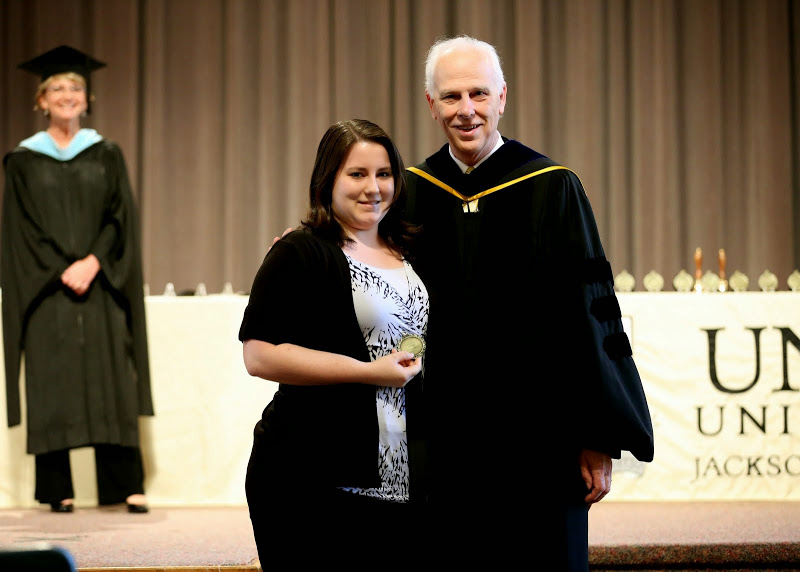History major Faith Bagley accepts the Academic Excellence Medal in History from Dr. Stephen Carls at the Union University Awards Day Convocation on May 1, 2015.  Photo by Kristi Woody