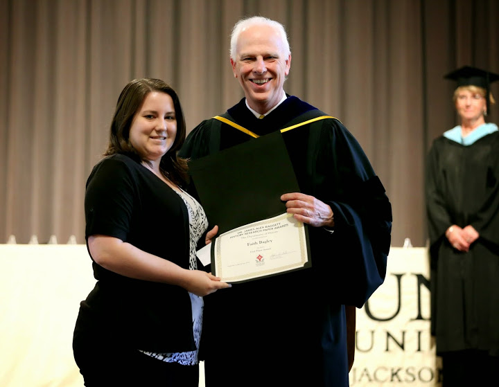 Dr. Stephen Carls presents the first place prize in the Dr. James Alex Baggett History Research Paper Competition to Faith Bagley at the Union University Awards Day Convocation on May 1, 2015. Photo by Kristi Woody