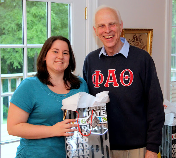 History major and Phi Alpha Theta member Faith Bagley accepts a graduation award bag from Dr. Stephen Carls at the 23rd Annual Phi Alpha Theta/History Department Cookout on May 8, 2015.